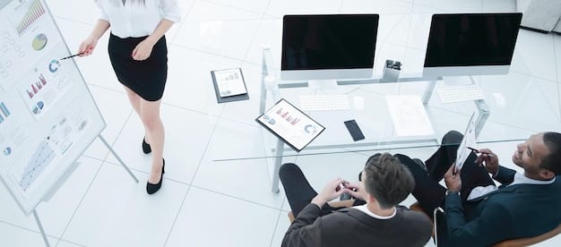A detailed image of a business team in a modern office, analyzing digital charts and global maps, emphasizing strategic planning, data analysis, and international collaboration in response to new trade agreements.