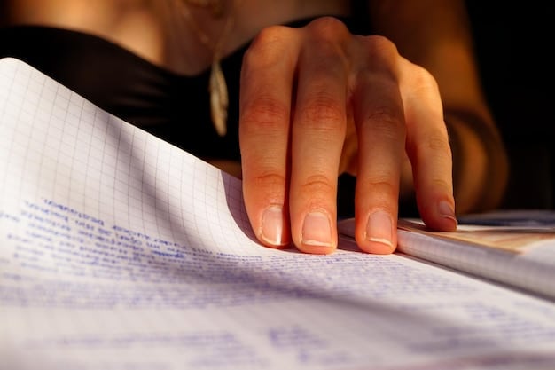 A person's hand highlighting a section in a student loan document, illustrating the importance of understanding terms and conditions.
