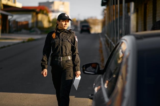 A border patrol agent in uniform, standing watch near a border fence, with enforcement vehicles in the background, symbolizing federal security operations.
