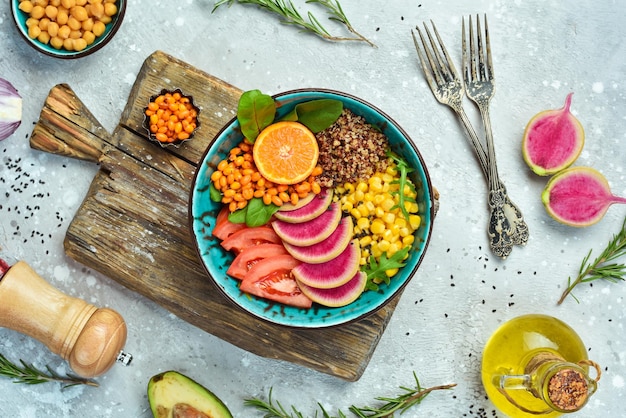 A close-up shot of a plate brimming with colorful, fiber-rich vegetables, whole grains, and a portion of lean fish, emphasizing a balanced and heart-healthy meal composition, well-lit from above.
