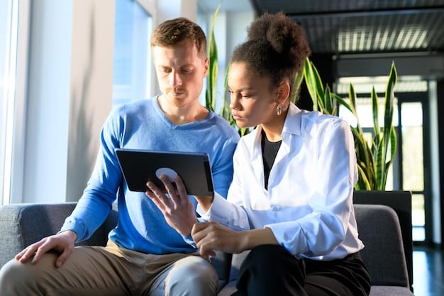 A doctor speaking with a patient about health report on a tablet, emphasizing proactive health discussions.