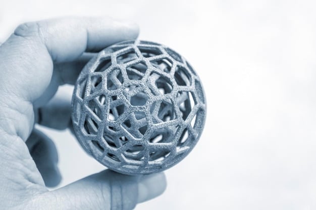 A close-up of a highly customized 3D-printed medical implant, showcasing intricate lattice structures and personalized contours, held by a researcher in a lab setting.